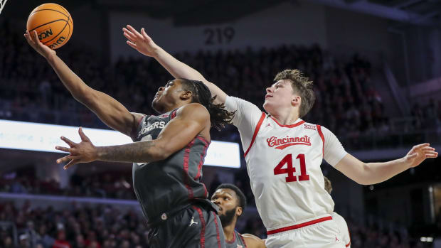 Jan 20, 2024; Cincinnati, Ohio, USA; Oklahoma Sooners guard Otega Oweh (3) shoots against Cincinnati Bearcats guard Simas Lukosius (41) in the first half at Fifth Third Arena. Mandatory Credit: Katie Stratman-USA TODAY Sports  